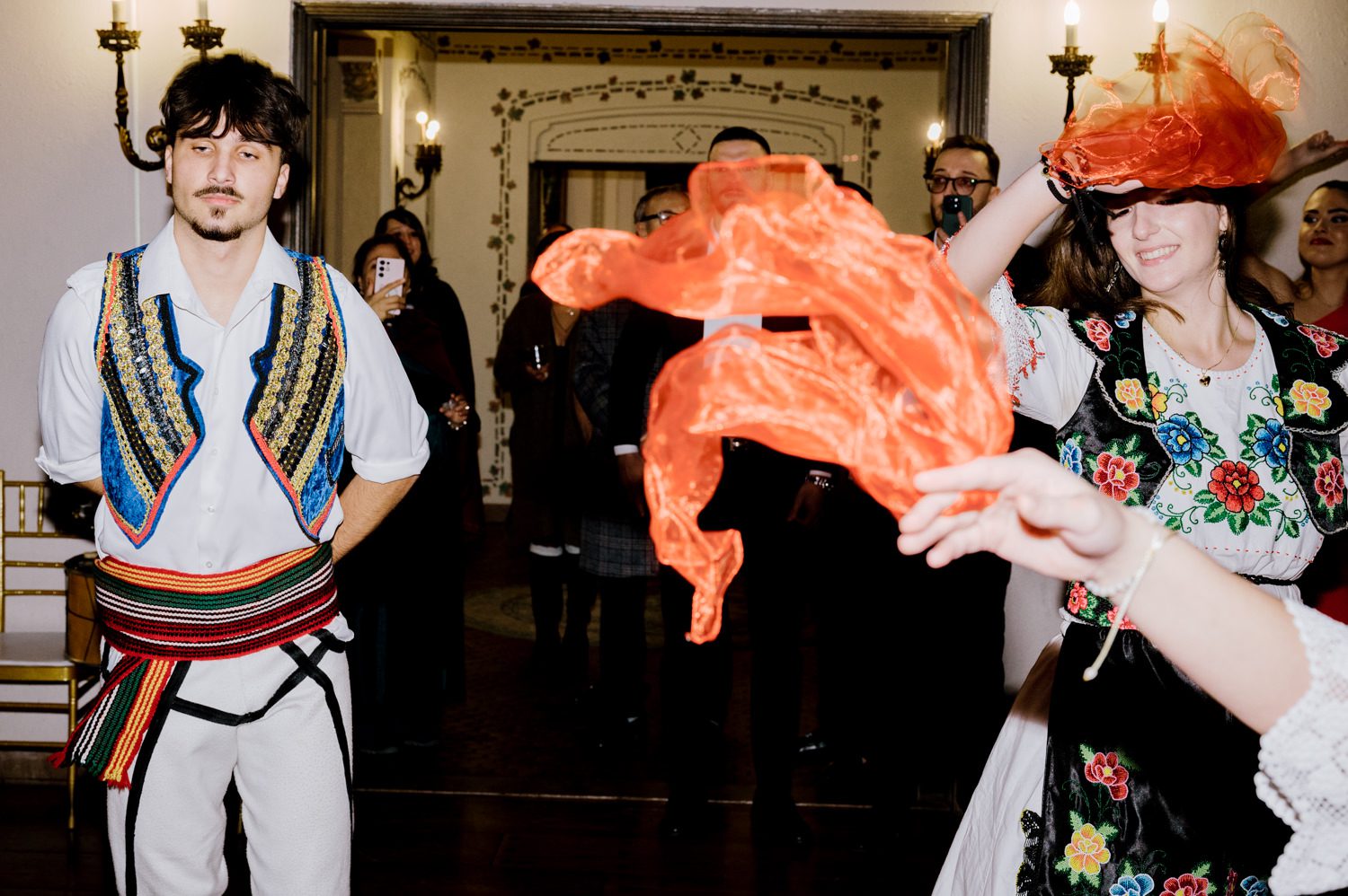 Kelsey and Liron Winter Wedding at Arrow Park, NY
My first wedding at Arrow Park was back in June 2022 when I had the pleasure of photographing Jackie and Aron’s wedding. From that moment, other wedding inquiries and opportunities arose, allowing me to capture the love stories of more wonderful couples at Arrow Park. That’s how I met Kelsey. Kelsey is the sales manager at Arrow Park, and since then, she has been a fan of my work. When it came time to plan her own wedding, I was delighted and honored that she chose me to document her beautiful celebration at Arrow Park.
Kelsey was well-prepared for the chilly weather, as she was getting married in December, so the wedding took place inside the mansion. When I arrived, Kelsey was finishing up her hair and makeup, just about ready to put on her dress. Families started to arrive, filling the space with warm greetings and laughter—one of my favorite scenes to witness on a wedding morning. Kelsey stepped into her dress, slipped on her gloves, and completed her final wedding preparations. She sparkled even more than the diamond on her finger as she walked over to see her groom.
As Kelsey walked down the aisle escorted by her father, emotions filled the room. Tears welled up in the eyes of their family and friends while Liron stood at the altar, watching her with a big smile. With their loved ones witnessing, Kelsey and Liron exchanged vows and sealed their marriage with a kiss.
Cocktail hour began with delicious hors d'oeuvres and drinks in hand, as guests excitedly welcomed the newlyweds into the room. Midway through the reception, Albanian dancers performed a traditional folk dance, bringing everyone to the dance floor as one big family. The night was filled with joy, laughter, and celebration. As all fun times do, the evening eventually came to an end, and we sent off Kelsey and Liron with a magical sparkler exit.
Winter Wedding Tips for Arrow Park, NY:
1. Embrace the Indoor Spaces: Arrow Park’s mansion provides an elegant and cozy setting for a winter wedding. The warm fireplaces and historic charm create a romantic atmosphere perfect for a chilly December day.
2. Prepare for the Cold: If you’re planning a winter wedding, consider stylish layers like faux fur wraps, long-sleeved dresses, or elegant gloves to stay warm while looking stunning.
3. Plan for Early Sunset: Winter days are shorter, so plan your timeline accordingly to make the most of natural light for photos. Consider a first look to capture beautiful portraits before it gets dark.
4. Add Seasonal Touches: Enhance the winter wedding ambiance with seasonal decor, such as candles, string lights, evergreen arrangements, and warm color palettes to complement the cozy indoor setting.
5. Offer Warm Beverages: Keep guests comfortable by serving hot cocoa, mulled wine, or warm cider during cocktail hour to add a festive and welcoming touch.
Kelsey and Liron’s wedding was a perfect example of how a winter celebration at Arrow Park can be both intimate and breathtaking. I was honored to capture their special day and look forward to photographing more magical winter weddings in this beautiful venue.
Kelsey and Liron's Arrow Park NY Wedding documented by Karis from Hey Karis New York, Brooklyn, Hudson Valley NY and Catskills NY and NJ Wedding and NYC Elopement Photographer.
