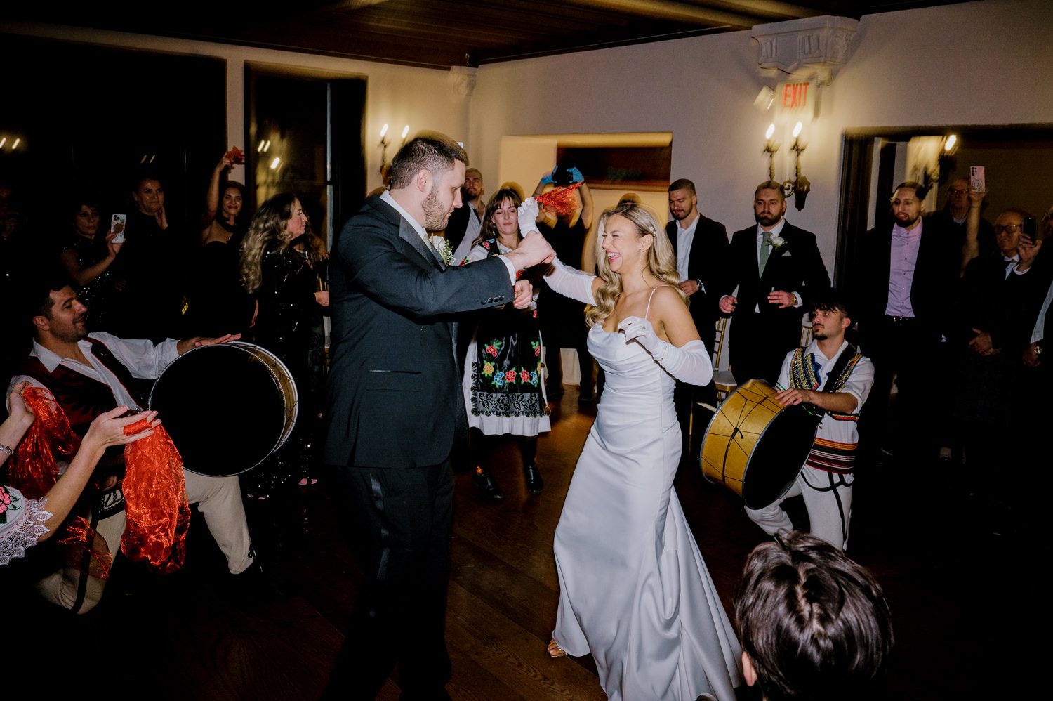 Kelsey and Liron Winter Wedding at Arrow Park, NY
My first wedding at Arrow Park was back in June 2022 when I had the pleasure of photographing Jackie and Aron’s wedding. From that moment, other wedding inquiries and opportunities arose, allowing me to capture the love stories of more wonderful couples at Arrow Park. That’s how I met Kelsey. Kelsey is the sales manager at Arrow Park, and since then, she has been a fan of my work. When it came time to plan her own wedding, I was delighted and honored that she chose me to document her beautiful celebration at Arrow Park.
Kelsey was well-prepared for the chilly weather, as she was getting married in December, so the wedding took place inside the mansion. When I arrived, Kelsey was finishing up her hair and makeup, just about ready to put on her dress. Families started to arrive, filling the space with warm greetings and laughter—one of my favorite scenes to witness on a wedding morning. Kelsey stepped into her dress, slipped on her gloves, and completed her final wedding preparations. She sparkled even more than the diamond on her finger as she walked over to see her groom.
As Kelsey walked down the aisle escorted by her father, emotions filled the room. Tears welled up in the eyes of their family and friends while Liron stood at the altar, watching her with a big smile. With their loved ones witnessing, Kelsey and Liron exchanged vows and sealed their marriage with a kiss.
Cocktail hour began with delicious hors d'oeuvres and drinks in hand, as guests excitedly welcomed the newlyweds into the room. Midway through the reception, Albanian dancers performed a traditional folk dance, bringing everyone to the dance floor as one big family. The night was filled with joy, laughter, and celebration. As all fun times do, the evening eventually came to an end, and we sent off Kelsey and Liron with a magical sparkler exit.
Winter Wedding Tips for Arrow Park, NY:
1. Embrace the Indoor Spaces: Arrow Park’s mansion provides an elegant and cozy setting for a winter wedding. The warm fireplaces and historic charm create a romantic atmosphere perfect for a chilly December day.
2. Prepare for the Cold: If you’re planning a winter wedding, consider stylish layers like faux fur wraps, long-sleeved dresses, or elegant gloves to stay warm while looking stunning.
3. Plan for Early Sunset: Winter days are shorter, so plan your timeline accordingly to make the most of natural light for photos. Consider a first look to capture beautiful portraits before it gets dark.
4. Add Seasonal Touches: Enhance the winter wedding ambiance with seasonal decor, such as candles, string lights, evergreen arrangements, and warm color palettes to complement the cozy indoor setting.
5. Offer Warm Beverages: Keep guests comfortable by serving hot cocoa, mulled wine, or warm cider during cocktail hour to add a festive and welcoming touch.
Kelsey and Liron’s wedding was a perfect example of how a winter celebration at Arrow Park can be both intimate and breathtaking. I was honored to capture their special day and look forward to photographing more magical winter weddings in this beautiful venue.
Kelsey and Liron's Arrow Park NY Wedding documented by Karis from Hey Karis New York, Brooklyn, Hudson Valley NY and Catskills NY and NJ Wedding and NYC Elopement Photographer.

