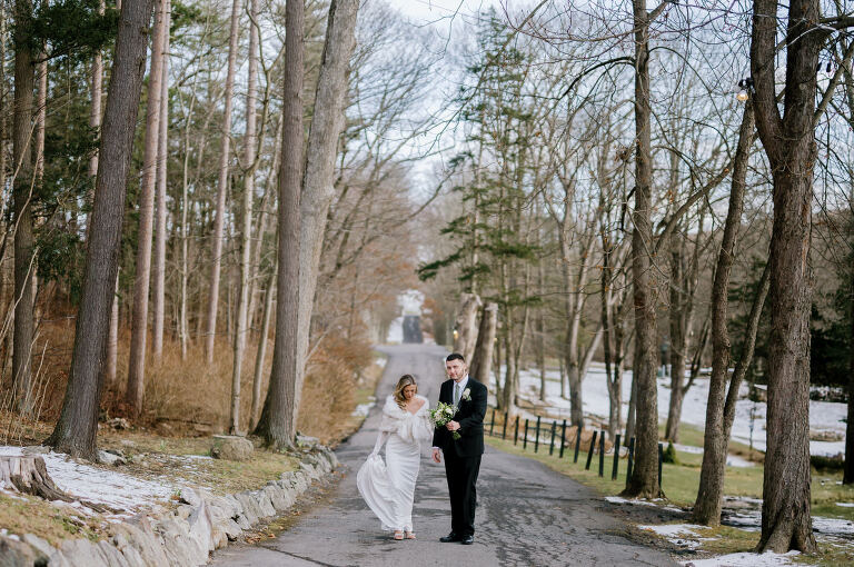 Kelsey and Liron Winter Wedding at Arrow Park, NY
My first wedding at Arrow Park was back in June 2022 when I had the pleasure of photographing Jackie and Aron’s wedding. From that moment, other wedding inquiries and opportunities arose, allowing me to capture the love stories of more wonderful couples at Arrow Park. That’s how I met Kelsey. Kelsey is the sales manager at Arrow Park, and since then, she has been a fan of my work. When it came time to plan her own wedding, I was delighted and honored that she chose me to document her beautiful celebration at Arrow Park.
Kelsey was well-prepared for the chilly weather, as she was getting married in December, so the wedding took place inside the mansion. When I arrived, Kelsey was finishing up her hair and makeup, just about ready to put on her dress. Families started to arrive, filling the space with warm greetings and laughter—one of my favorite scenes to witness on a wedding morning. Kelsey stepped into her dress, slipped on her gloves, and completed her final wedding preparations. She sparkled even more than the diamond on her finger as she walked over to see her groom.
As Kelsey walked down the aisle escorted by her father, emotions filled the room. Tears welled up in the eyes of their family and friends while Liron stood at the altar, watching her with a big smile. With their loved ones witnessing, Kelsey and Liron exchanged vows and sealed their marriage with a kiss.
Cocktail hour began with delicious hors d'oeuvres and drinks in hand, as guests excitedly welcomed the newlyweds into the room. Midway through the reception, Albanian dancers performed a traditional folk dance, bringing everyone to the dance floor as one big family. The night was filled with joy, laughter, and celebration. As all fun times do, the evening eventually came to an end, and we sent off Kelsey and Liron with a magical sparkler exit.
Winter Wedding Tips for Arrow Park, NY:
1. Embrace the Indoor Spaces: Arrow Park’s mansion provides an elegant and cozy setting for a winter wedding. The warm fireplaces and historic charm create a romantic atmosphere perfect for a chilly December day.
2. Prepare for the Cold: If you’re planning a winter wedding, consider stylish layers like faux fur wraps, long-sleeved dresses, or elegant gloves to stay warm while looking stunning.
3. Plan for Early Sunset: Winter days are shorter, so plan your timeline accordingly to make the most of natural light for photos. Consider a first look to capture beautiful portraits before it gets dark.
4. Add Seasonal Touches: Enhance the winter wedding ambiance with seasonal decor, such as candles, string lights, evergreen arrangements, and warm color palettes to complement the cozy indoor setting.
5. Offer Warm Beverages: Keep guests comfortable by serving hot cocoa, mulled wine, or warm cider during cocktail hour to add a festive and welcoming touch.
Kelsey and Liron’s wedding was a perfect example of how a winter celebration at Arrow Park can be both intimate and breathtaking. I was honored to capture their special day and look forward to photographing more magical winter weddings in this beautiful venue.
Kelsey and Liron's Arrow Park NY Wedding documented by Karis from Hey Karis New York, Brooklyn, Hudson Valley NY and Catskills NY and NJ Wedding and NYC Elopement Photographer.
